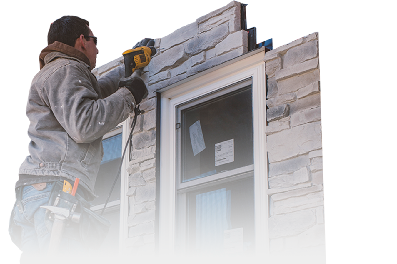 Siding Contractor putting on a stone facade siding